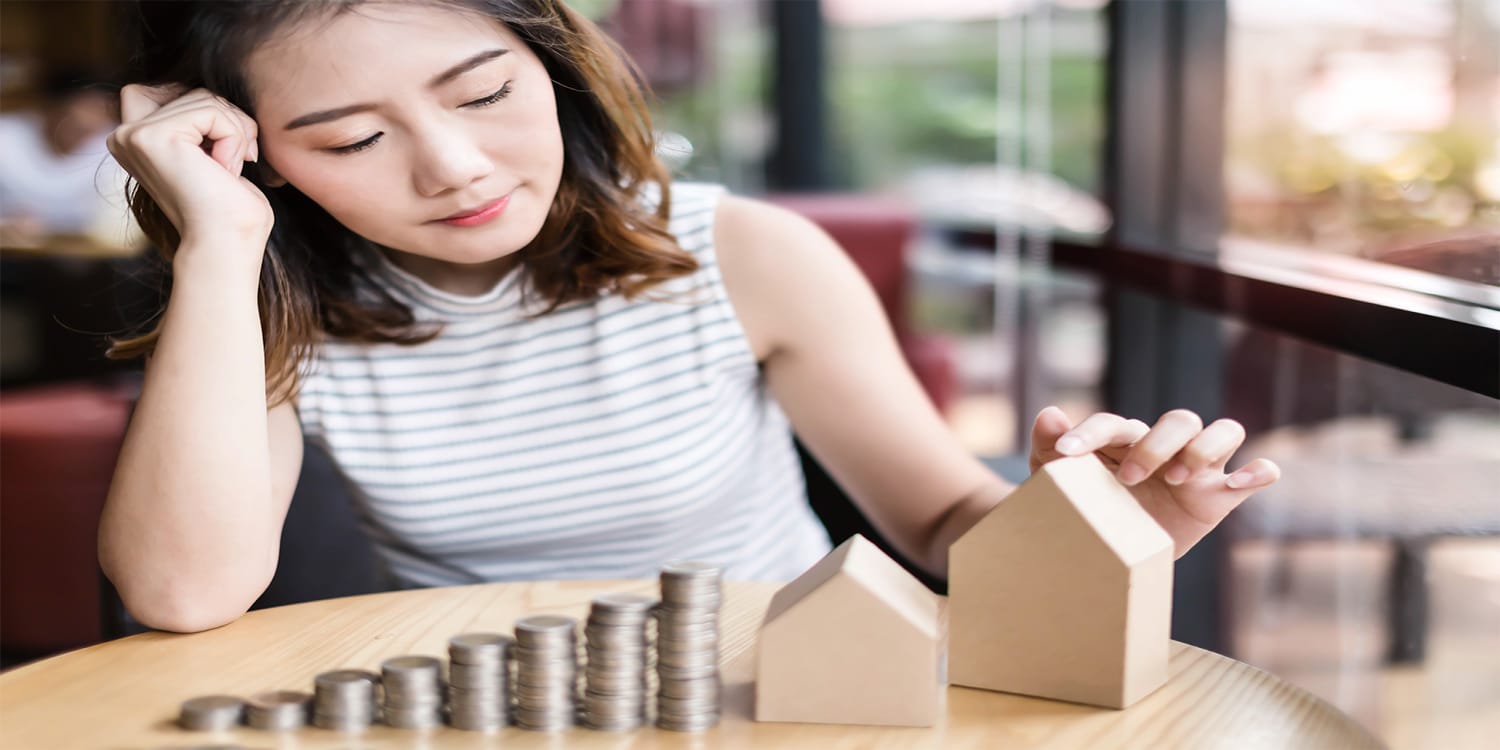 Woman pondering her home selling mistakes.